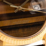 Closeup Photo of a Rolex Datejust 1601 Tiger Eye from 1974. 36mm with 18K yellow gold case, Tiger Eye stone dial, Automatic movement and Leather strap.
