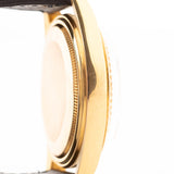Closeup Photo of a Rolex Datejust 1601 Tiger Eye from 1974. 36mm with 18K yellow gold case, Tiger Eye stone dial, Automatic movement and Leather strap.